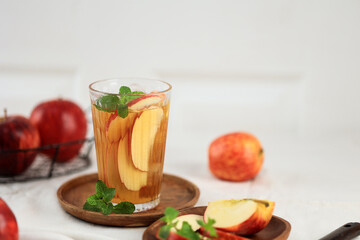 Apple Tea Cider with on White Wooden Table, Copy Space for Text.
