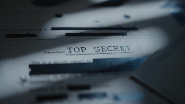 Extreme close up on top secret labeled document with classified censored text. Retro looking paper marked as secret and with sensitive government agency blacked out information and intelligence data