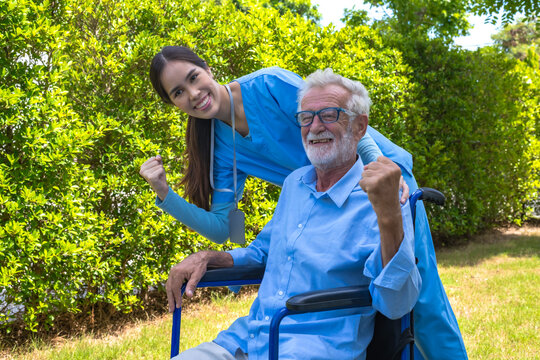 Asian female caregiver taking care of male elderly pensioner in homecare - Powered by Adobe