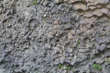detail of a wall of vertical basalt columns near Hjalparfoss in the icelandic highlands