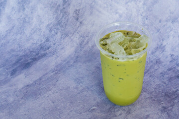 green tea on grey table in cafe.