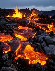 Molten lava flows across volcanic landscape