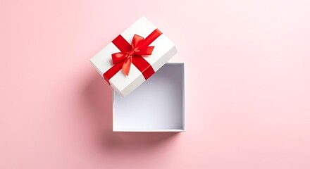 Open white gift box with red ribbon on pink background