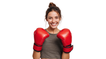 Smiling woman in boxing gloves, ready for a match, showcasing confidence and determination.
