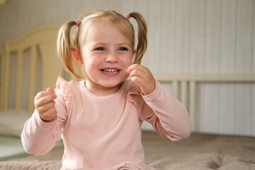 Little Girl joking sticking tongue out with silly expression. Child making face. Funny foolishness...