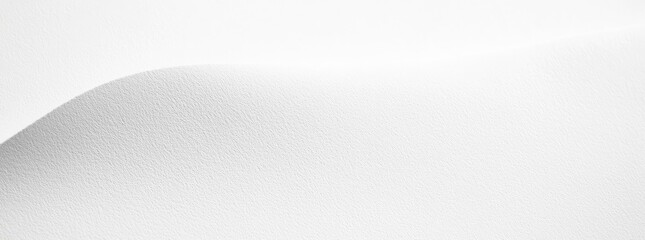 Smooth, textured, white surface with subtle curve