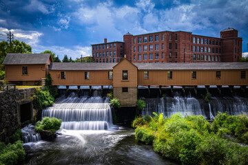 Autumn landscape after a rainstorm in Lowell, Massachusetts. Blue clouds drift above the Lower...