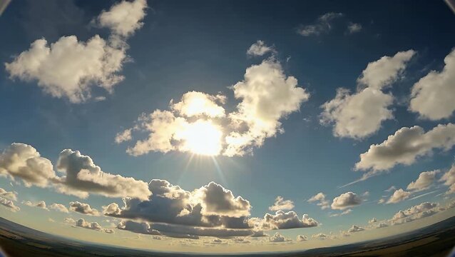 wide angle 4k ultra high definition panoramic timelapse of moving white clouds across a radiant daytime sky, filled with natural sunlight cinematic weather patterns perfect nature backdrops, stock