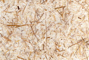 Hand made old vintage distressed textured brown paper background with embedded straw for which is empty and blank with copy space, stationary stock photo image