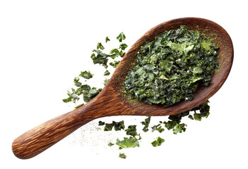 Wooden spoon filled with chopped, dried green leafy vegetable, scattered around it
