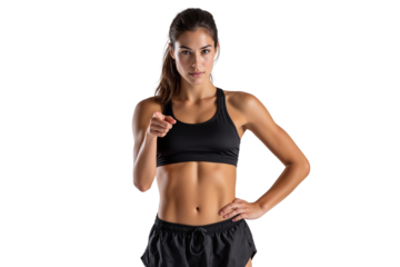Young fit woman in sports bra and shorts, pointing to the camera with a determined look