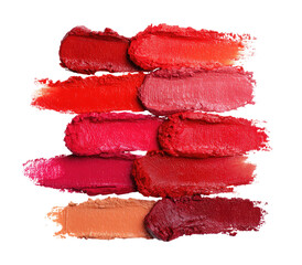 Swatches of various shades of red lipstick. A collection of smeared lipstick colors. Vibrant hues of red, pink, and peach