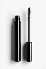 Obraz premium Black mascara tube and wand on white background