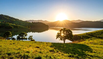 Sunrise over a serene lake in a valley