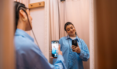 Selfie in Dressing Room A Young Woman Enjoying Trying on Different Clothes