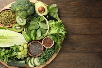 Superfood. Different healthy products on wooden table, top view. Space for text