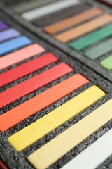 Set of colorful chalk pastels in box, closeup