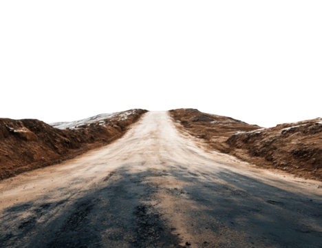 Empty dirt road winding through a landscape