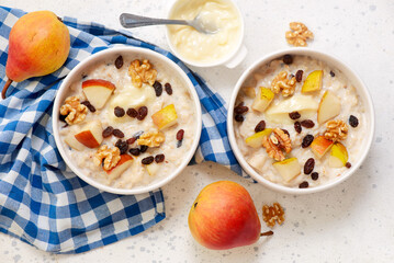 Oatmeal with pears, walnuts and raisins.top veiw