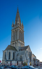 Fototapeta premium Langrune-Sur-Mer, France - 08 09 2025: Panoramic view the facade of the Saint-Martin Church and the cemetery