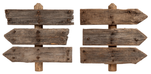 Two rustic wooden directional signs.  Multiple weathered wooden boards fastened to a central post, with arrow shapes cut out