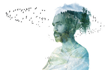 Double exposure portrait of calm man with curly hair blended with forest and flying birds.