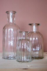 Elegant glass vases in varying heights and shapes, showcasing intricate ribbed designs, perfect for home decoration and enhancing interior style with modern aesthetics