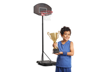 Boy winning a trophy cup in a basketball championship
