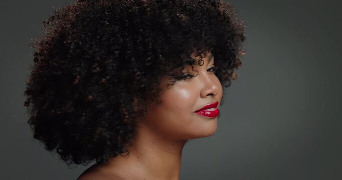 Face, woman and beauty for hair care in studio for detangling, natural growth and afro volume. Portrait, African female person and proud of texture, maintenance and scalp treatment on gray background