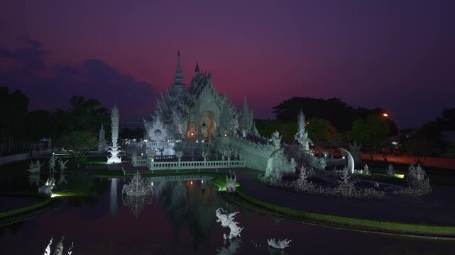 Majestic white temple wat rong khun at sunset in Chiang Rai, Thailand.
