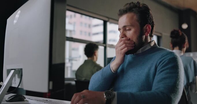 Business, yawning and man with computer, tired and copywriting with burnout, overworked and brain fog. Person, employee and journalist in workplace, PC and exhausted with deadline, research or sleepy