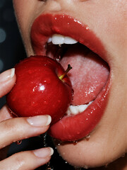 close up of a woman eating an apple 787656