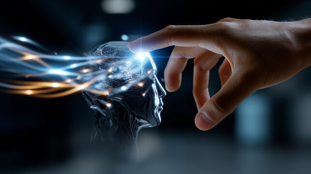 Silhouette of a hand hovering over a glowing AI-style robotic head, light trails filling the lower frame.