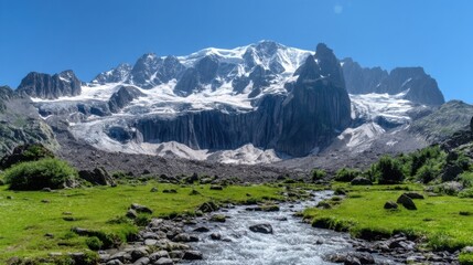 Obraz premium A majestic snow-capped mountain with rocky ridges and cascading ice formations stands tall against a clear blue sky.