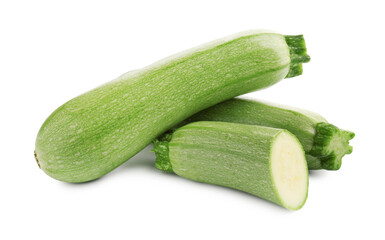 Fresh whole and cut zucchinis isolated on white