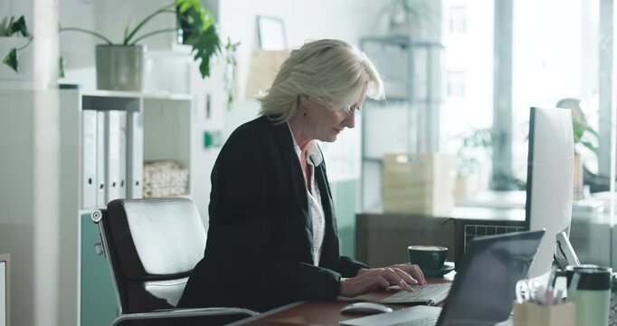 Computer, mature and business woman typing email, environmental policy or research online. Laptop, sustainability manager or reading in office for green project, review or eco friendly report for csr