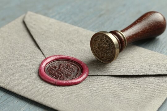 Gray envelope sealed with crimson wax and vintage stamp