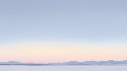 Obraz premium A tranquil seascape during dawn or dusk with calm water reflecting the sky, distant mountains forming a natural horizon,