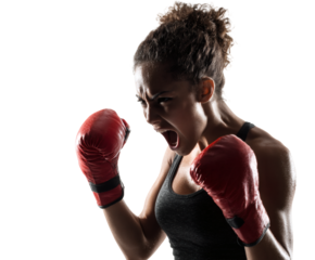 Female boxer in action, showing determination and strength with red gloves.