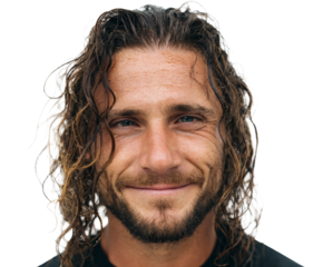 Portrait of a man with long, wet hair smiling at the camera