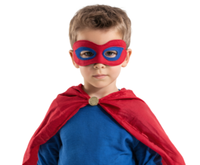 Young boy dressed as a superhero looking confidently at the camera.