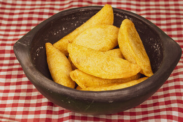 Delicious traditional Colombian empanadas with spicy sauce