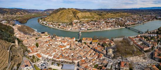 An aerial panorama view around the old town in the city Tournon-sur-Rhône in France on a sunny morning in early spring