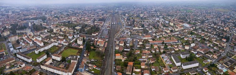 An aerial panorama view around the old town in the city Bourg-en-Bresse in France on a cloudy morning in early spring
