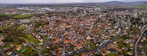 An aerial panorama view around the old town in the city Molsheim in France on a cloudy morning in early spring