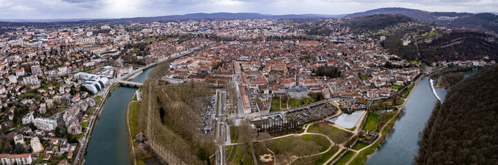 Aerial view of the old town of the city Besancon in France on a cloudy afternoon in early spring.