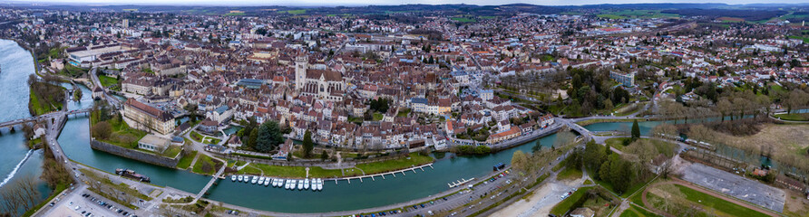 Aerial view of the old town of the city Dole in France on a cloudy afternoon in early spring.