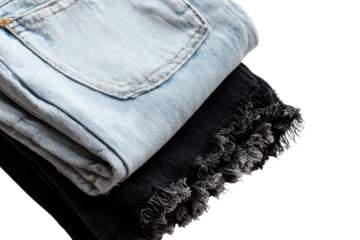 Two pairs of folded jeans, light blue and dark gray/black, stacked.  Frayed hems are visible