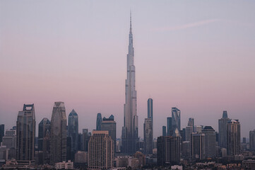 Naklejka premium Modern city skyline at dusk panoramic view with tallest skyscraper