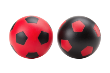 Two soccer balls, red and black, isolated on black